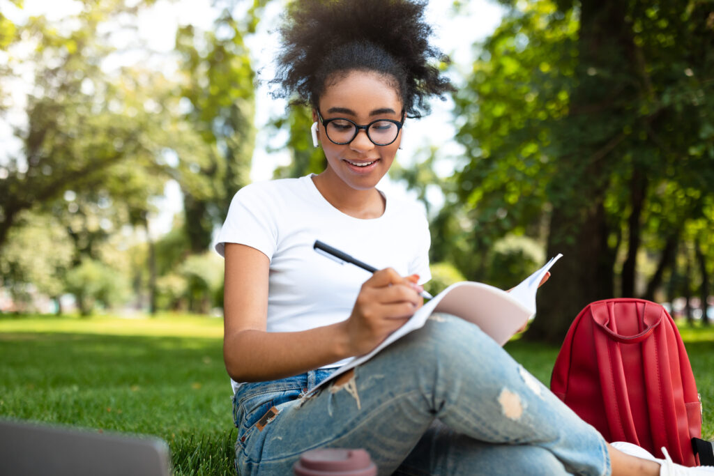 young girl studying in the park